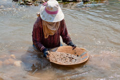 woman-washing-gold-river-13623411